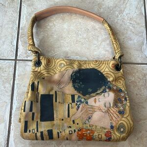 This bag from Italy is sports The Kiss by Gustav Klimt.  Feels like suede.